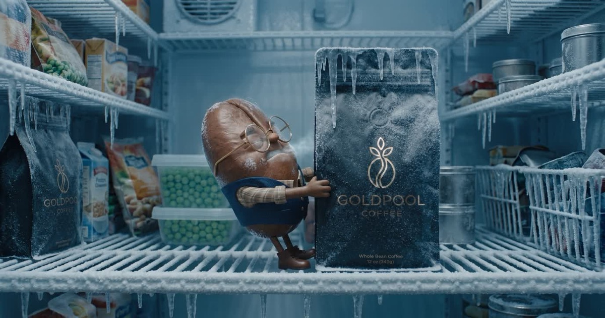 3D animated Professor Bean character shivering inside a frost-covered freezer, holding onto an iced-over 12oz GoldPool Whole Bean Coffee bag